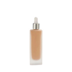 Invisible Touch Liquid Foundation – durchsichtige Flasche mit Tropfspender, weißer Hintergrund – Make-up
