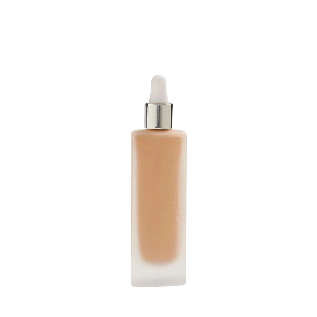 Invisible Touch Liquid Foundation – durchsichtige Flasche mit Tropfspender, weißer Hintergrund – Make-up