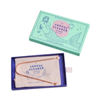 Cosmic Dealer Tongue Cleaner – mint green gift box with rose gold cleaner, white background – oral care