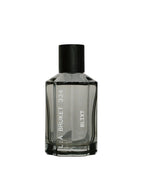 L:A Bruket No. 334 Blixt Eau de Parfum – dark gray glass bottle with black cap, white background – perfume
