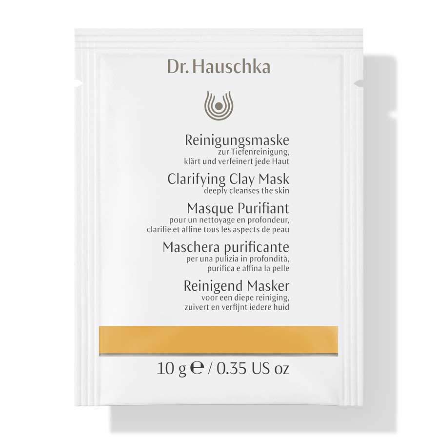Dr. Hauschka Reinigungsmaske Sachet 10g, weißes Beutelchen mit goldener Leiste, weißer Hintergrund – Hautpflege