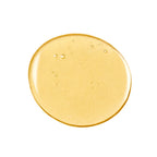 Pure Harmony Hairbath – goldene Flüssigkeit mit Luftblasen auf weißem Hintergrund – Haarpflege