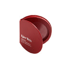 Kjaer Weis LightSlip Powder Highlighter – round red powder compact, white background – face highlighter