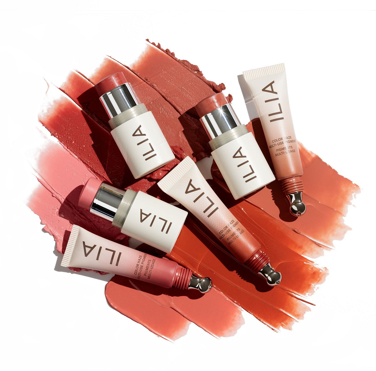 ILIA Color Haze Multi-use Pigment – cremefarbene Tube mit silbernem Deckel, rosafarbener Inhalt, weißer Hintergrund – Make-up