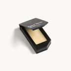Kiehl's Black Edition Lip Balm – black textured box, cream-colored balm, white background – lip care