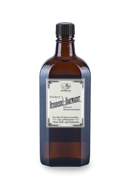 Nierle’s Brennessel-Haarwasser – braune Glasflasche mit schwarzem Schraubverschluss, weißem Etikett und weißem Hintergrund – Haarpflege