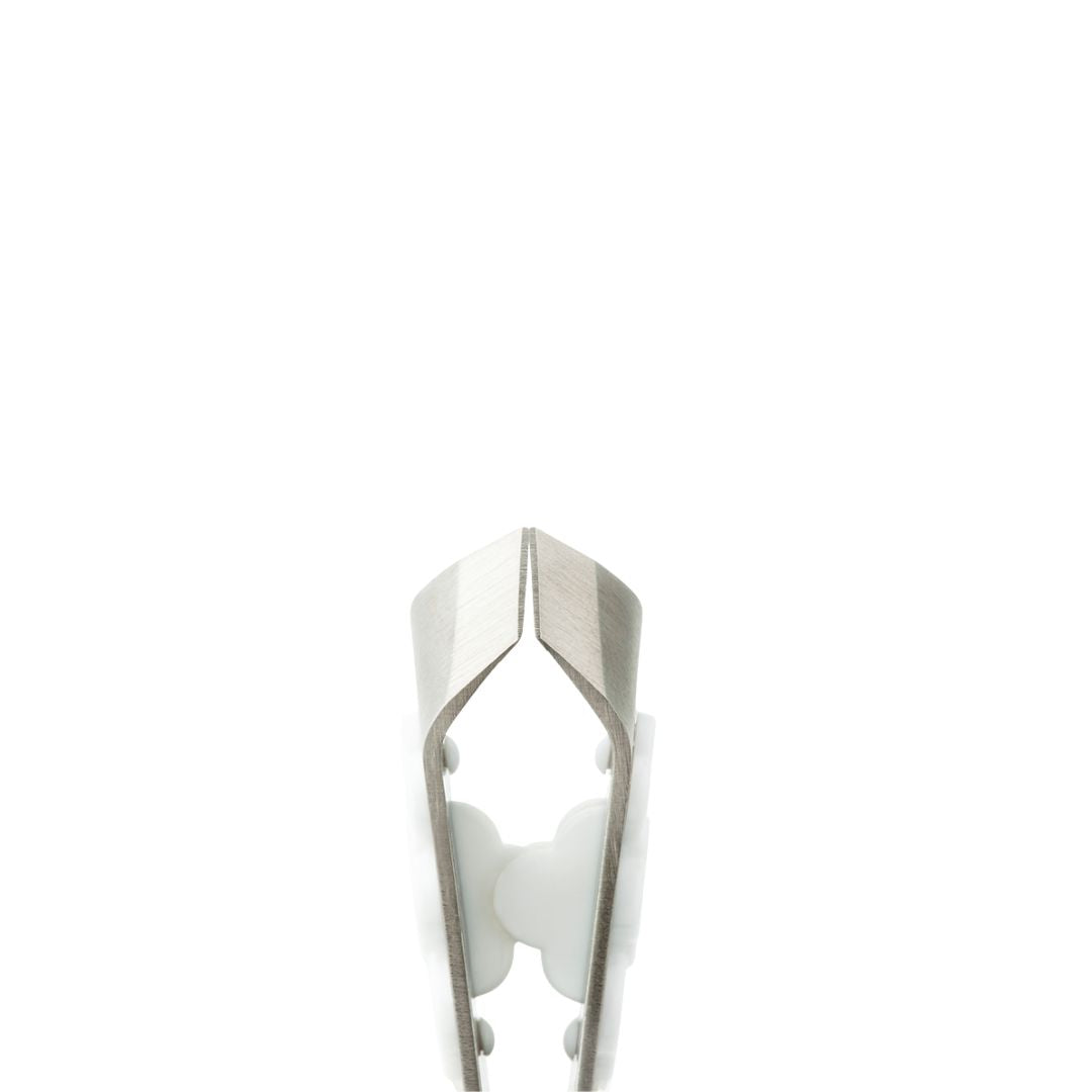 Compact Nippers – metallic silver tool with white handle on white background – nail care