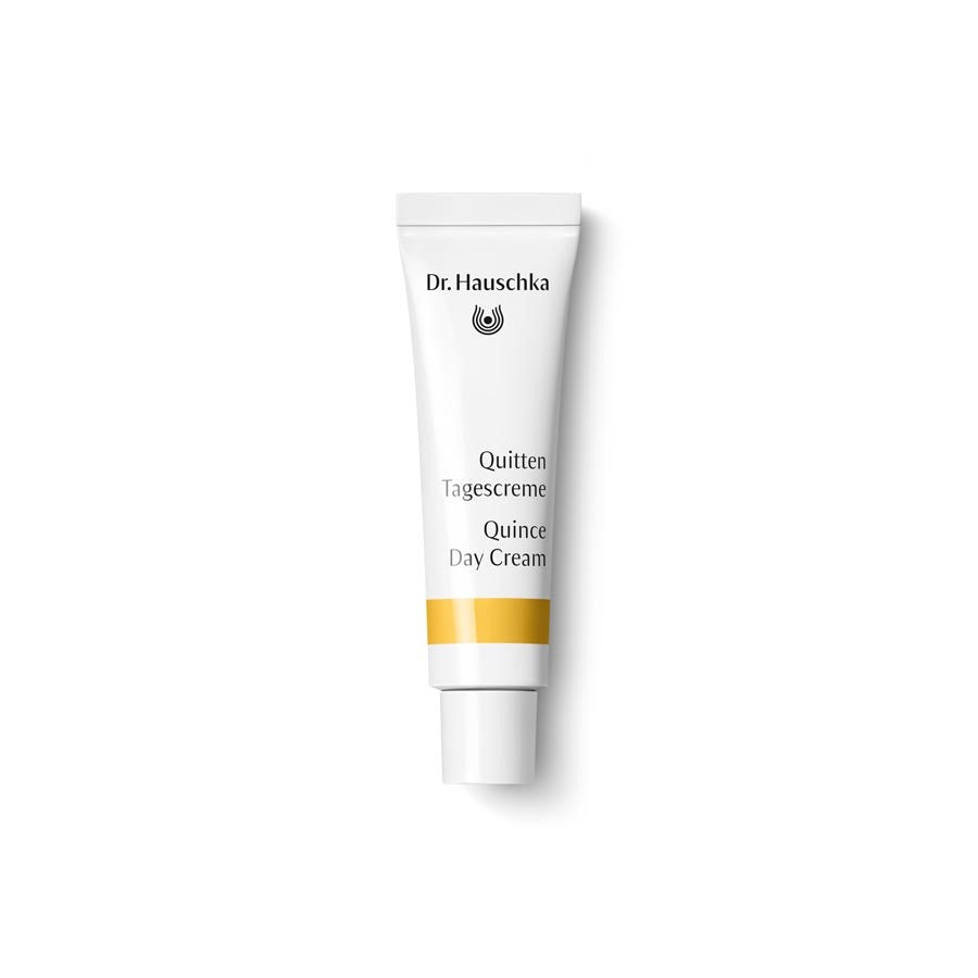 Dr. Hauschka Quitten Tagescreme – weiße Tube mit gelber Linie, weißem Verschluss, weißem Hintergrund – Hautpflege