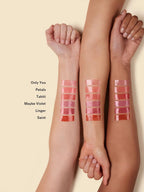 Balmy Gloss Tinted Lip Oil color swatches in various shades on arms, lip care