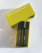 L:A BRUKET No. 335 Dísir Eau de Parfum – dark glass bottle with black spray cap, yellow box, white background – perfume