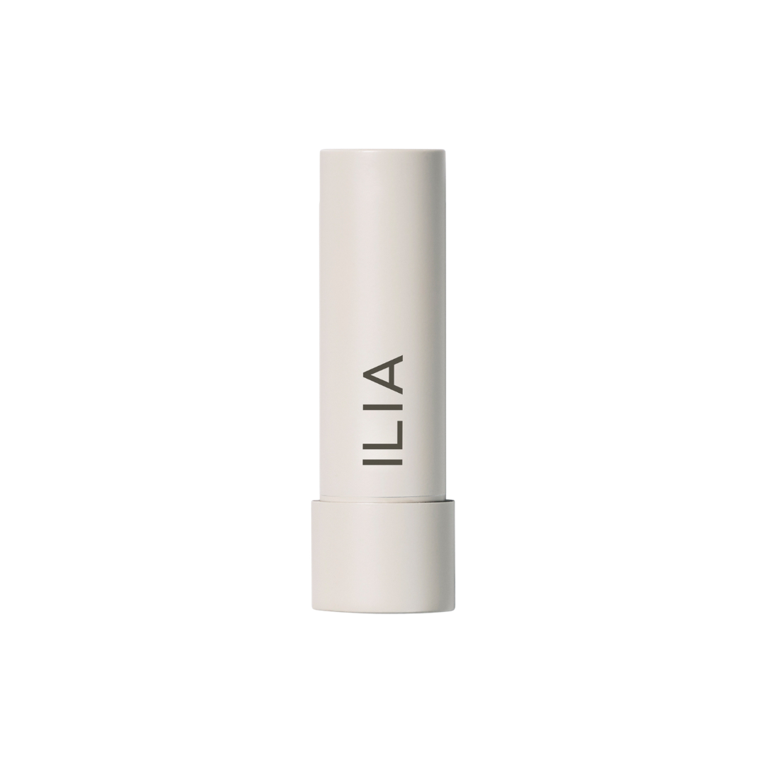 ILIA Balmy Tint Hydrating Lip Balm – cremefarbener Stift, weißer Hintergrund – Lippenpflege