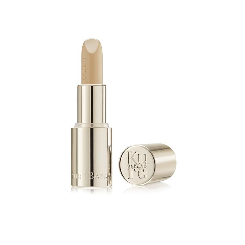 Kure Bazaar Clean Base Mat Lipstick – goldener Lippenstift-Tube, cremefarbene Farbe, weißer Hintergrund – Lippenpflege