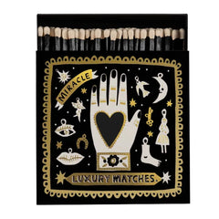 Black Miracle Luxury – schwarze Streichholzschachtel mit gold-weißem Design, weißer Hintergrund – Deko