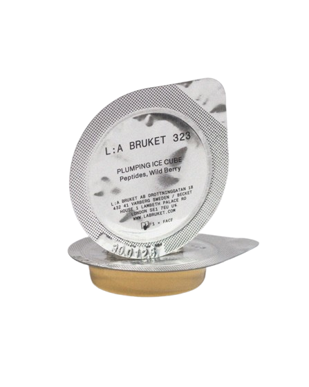 L:A BRUKET 323 Plumping Ice Cube – silver single-dose packaging, gold base, white background – skin care