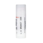L:A Bruket No. 336 Replenishing Lip & Cheek Balm in a white stick tube against a white background, skin care.
