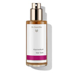 Dr. Hauschka Haartonikum – brown glass bottle with spray nozzle, white label and purple stripe, white background – hair care