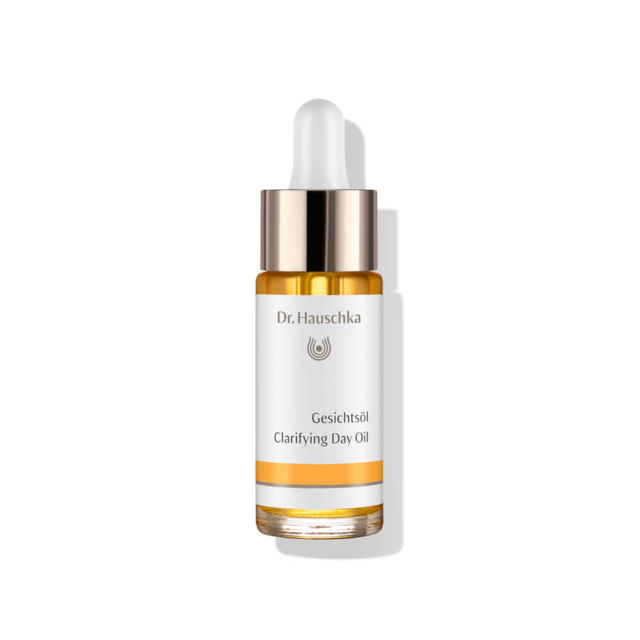 Dr. Hauschka Gesichtsöl – klares Glasfläschchen mit Tropfer, weiß-orangefarbener Etikett, weißem Hintergrund – Hautpflege