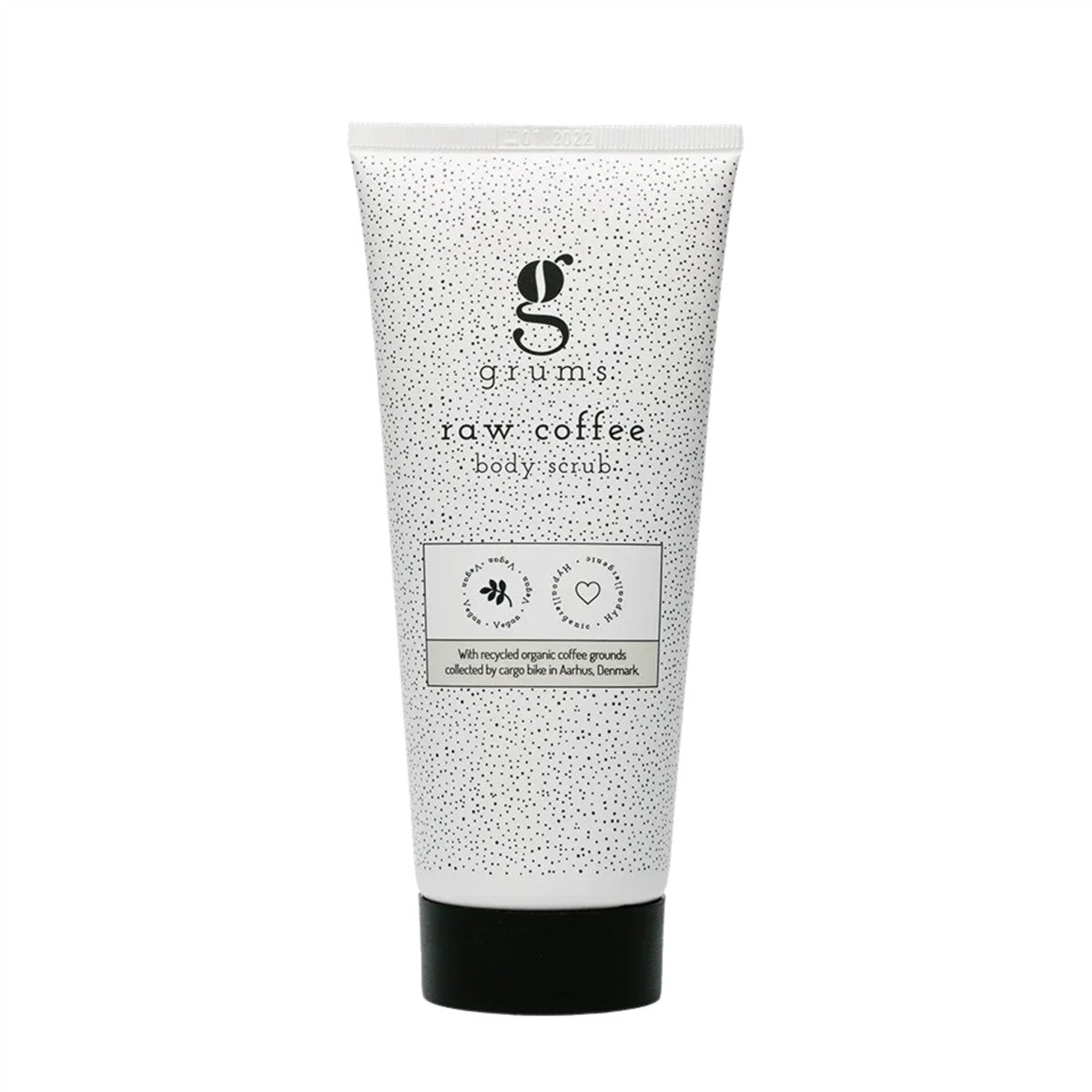 grums Raw Coffee Body Scrub – weiße Tube mit schwarzen Punkten, schwarzer Verschluss, weißem Hintergrund – Körperpeeling