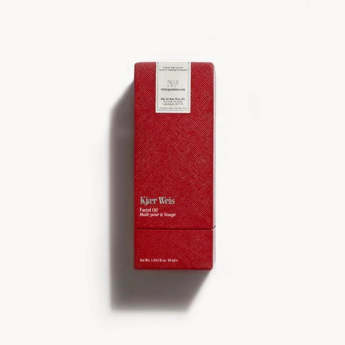 Kjaer Weis Facial Oil – red textured box 30ml, white label on white background – skin care