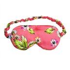 Le Flora sleep mask in pink with floral pattern and elastic band.