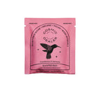 Cosmic Alchemy Dealer Himbeere mit Macadamia – rosa Einwegbeutel, weißer Hintergrund – vegane Schokolade