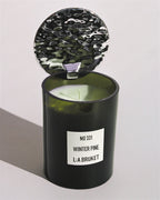 L:A BRUKET Candle No 331 Winter Pine – dark green glass jar with textured lid, white background – scented candles