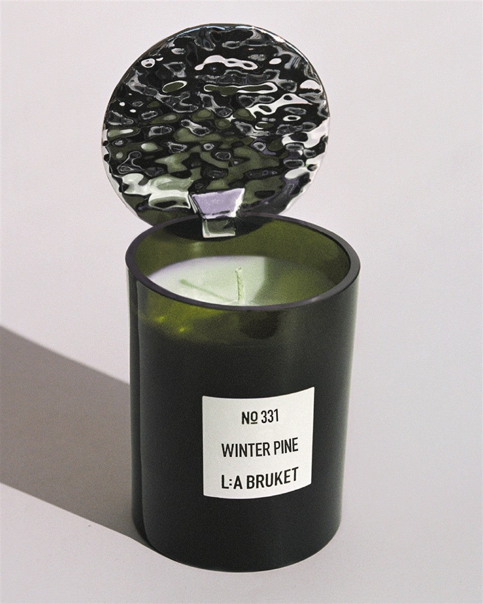 L:A BRUKET Candle No 331 Winter Pine – dark green glass jar with textured lid, white background – scented candles
