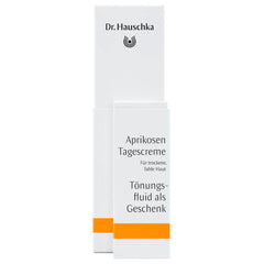 Dr. Hauschka Aprikosen Tagescreme – weiße Kartonverpackung mit orangefarbenem Streifen, weißer Hintergrund – Hautpflege