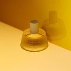 Abel Miami Split Eau de Parfum – clear glass bottle 50ml, white cylinder cap, yellow background – perfume