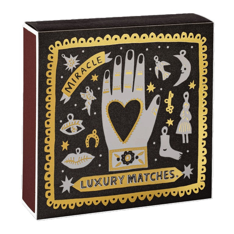 Black Miracle Luxury – schwarze Geschenkbox mit gold-silberner Magiegrafik, weißem Hintergrund – Beauty-Geschenk