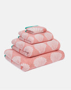 Shells Organic Cotton Waschlappen – rosa mit Muschelmuster, grüner Saum, weißer Hintergrund – Hautpflege