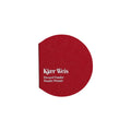 Kjaer Weis Pressed Powder – round red powder compact, white background – makeup