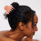 Puffy Claw Clip Large – peach hair clip in bun, white background – hair styling