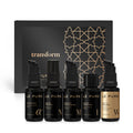 LE PURE Treatment Set Transform – fünf schwarze Fläschchen mit Pumpen, goldene Akzente, schwarzer Hintergrund – Hautpflege