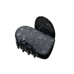 Haarklammer Herz Onyx – black marbled heart-shaped hair clip on white background – hair styling