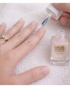 Kure Bazaar Base Intensive Hyaluronique – clear glass bottle, white cap, cream background – nail care
