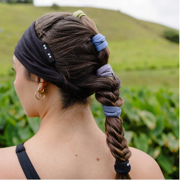 Sea to Sky plastic free flat hair ties – multicolor in braid, green background – hair care