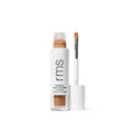 rms beauty Revitalize Hydra Concealer in beige, open with applicator on white background.
