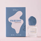 Fascent Corn Star Eau de Parfum – clear glass bottle 30ml, blue cap, blue box, pink background – perfume