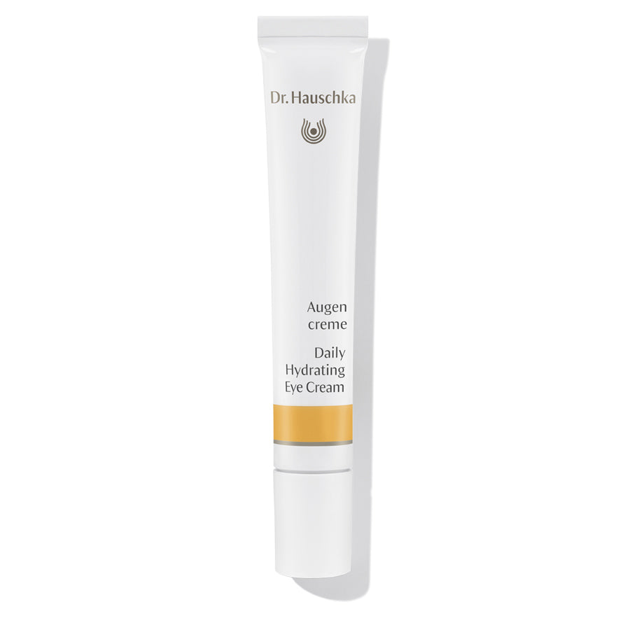 Dr. Hauschka Augencreme – weiße Tube mit weißem Deckel, orangefarbener Akzentstreifen, weißem Hintergrund – Augenpflege