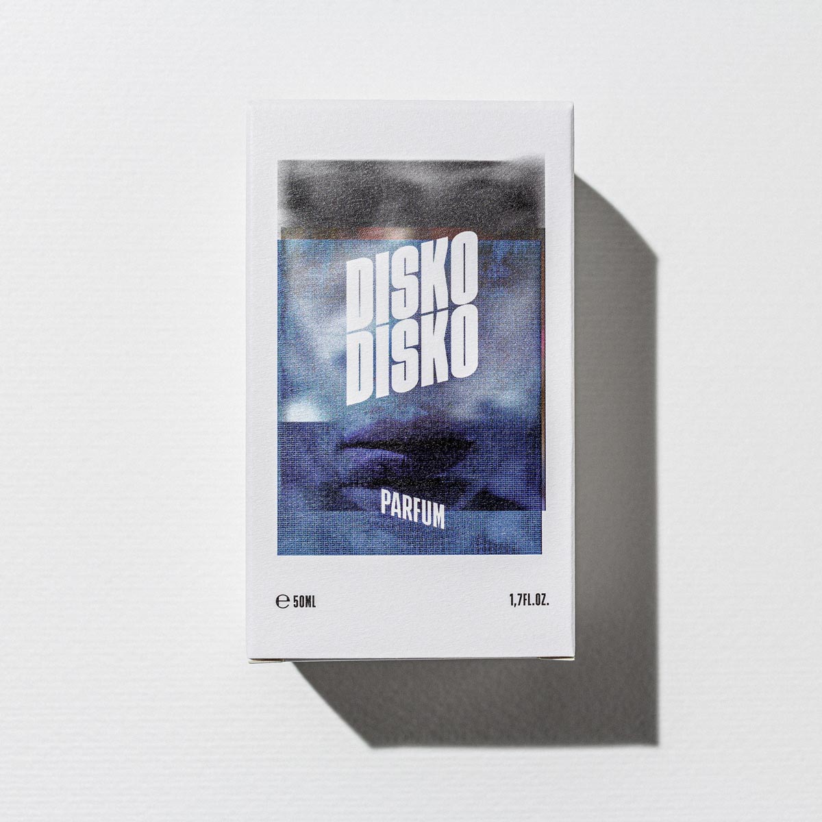 Disko Disko Parfum – white cardboard box 50ml, blue-white design, white background – perfume