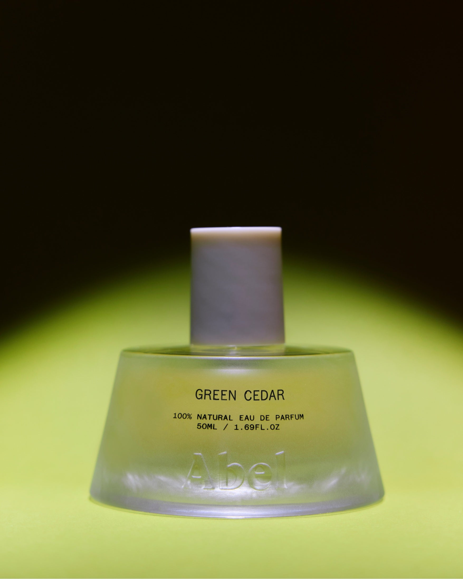Abel Green Cedar Eau de Parfum – 50ml green glass bottle with white cap, bright green background – perfume