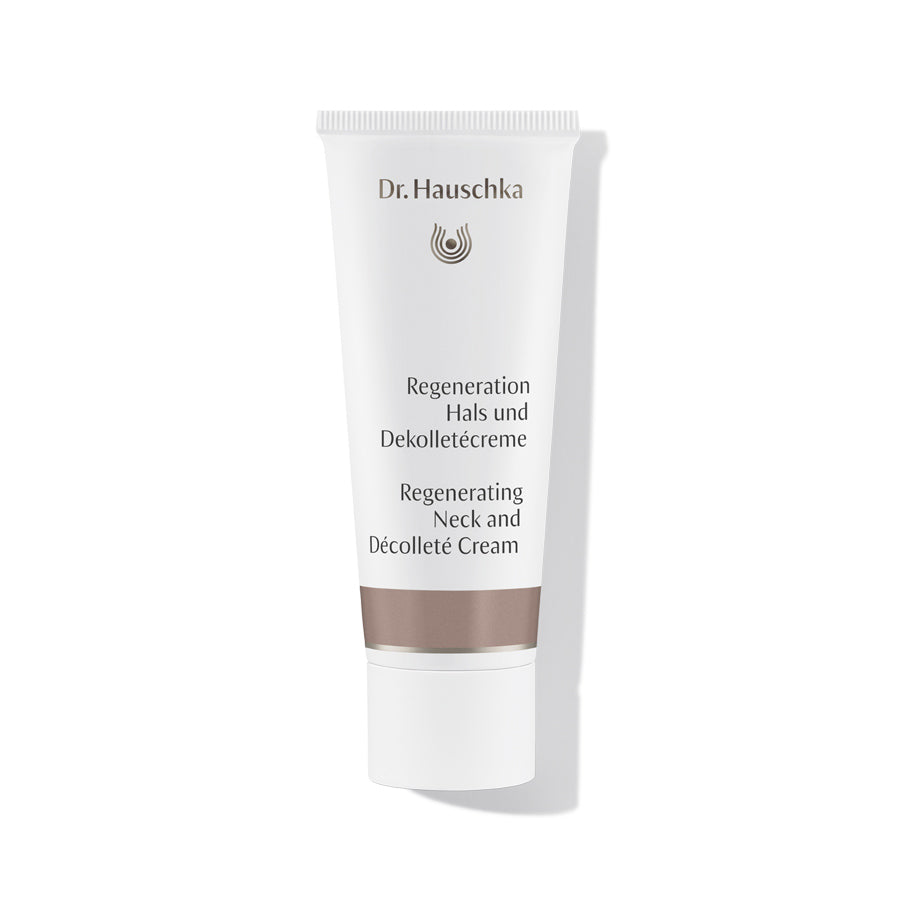 Dr. Hauschka Regeneration Hals- und Dekolletécreme – weiße Tube mit braunem Band, weißem Hintergrund – Hautpflege