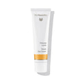 Dr. Hauschka Tönungscreme – weiße Tube mit orangefarbenem Streifen, weißem Deckel, weißem Hintergrund – Gesichtspflege