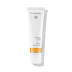 Dr. Hauschka Tönungscreme – weiße Tube mit orangefarbenem Streifen, weißem Deckel, weißem Hintergrund – Gesichtspflege