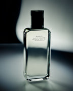 (M)ANASI 7 Botanical Body Oil – clear glass bottle with black cap, dark background – body care