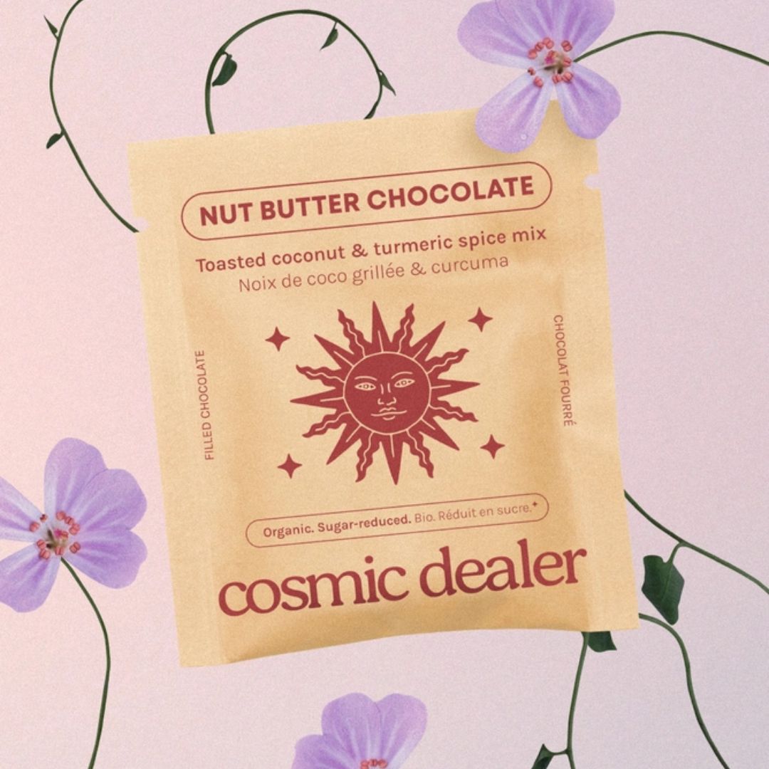 Cosmic Dealer Nut Butter Chocolate – beige pouch with red sun design, purple flower background – snack