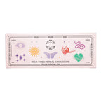 Cosmic Alchemy Dealer High-Vibes Herbal Chocolate – pink packaging 140g, magical symbols, white background – indulgence