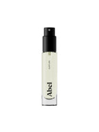 Abel Nurture Eau de Parfum – clear glass bottle with black spray nozzle, white background – perfume