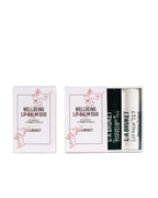 L:A BRUKET Wellbeing Lip Balm Duo Kiss – white box with two tubes, 14g each, white and black casing – lip care